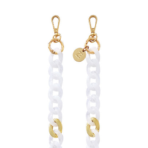 Chaînes-bijoux – Collection Milky Way : accessoires de téléphone élégants en acrylique et acier doré, inspirés du cosmos, de la lumière et de l’énergie céleste.